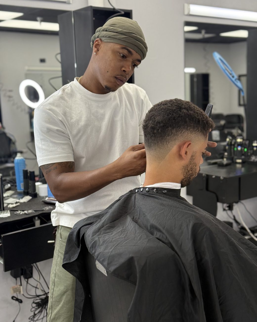 Brandon detailing the hairline on a client