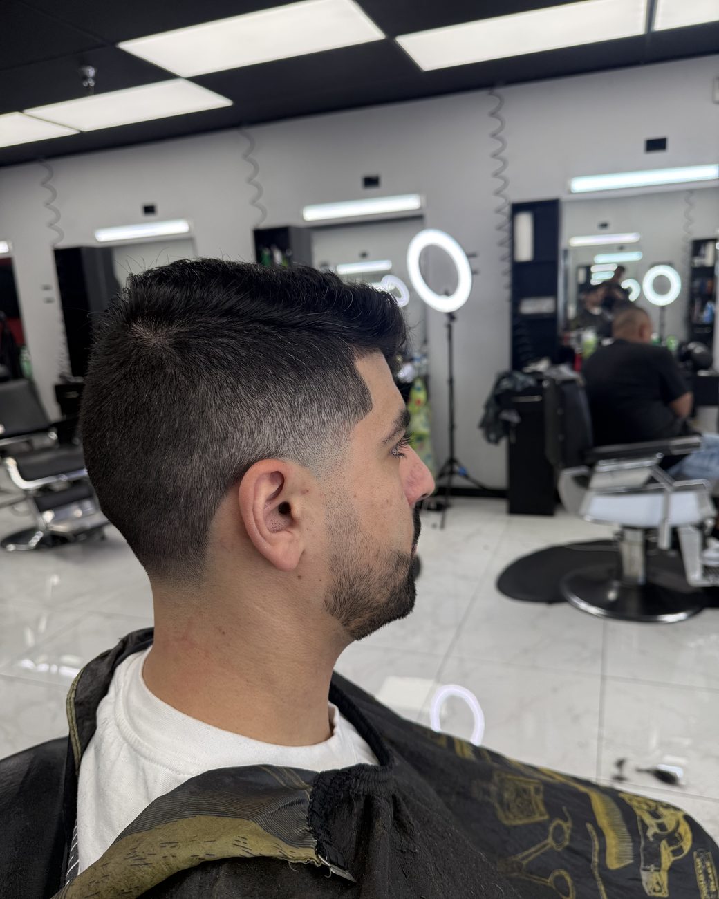 Finished taper fade with textured top and beard