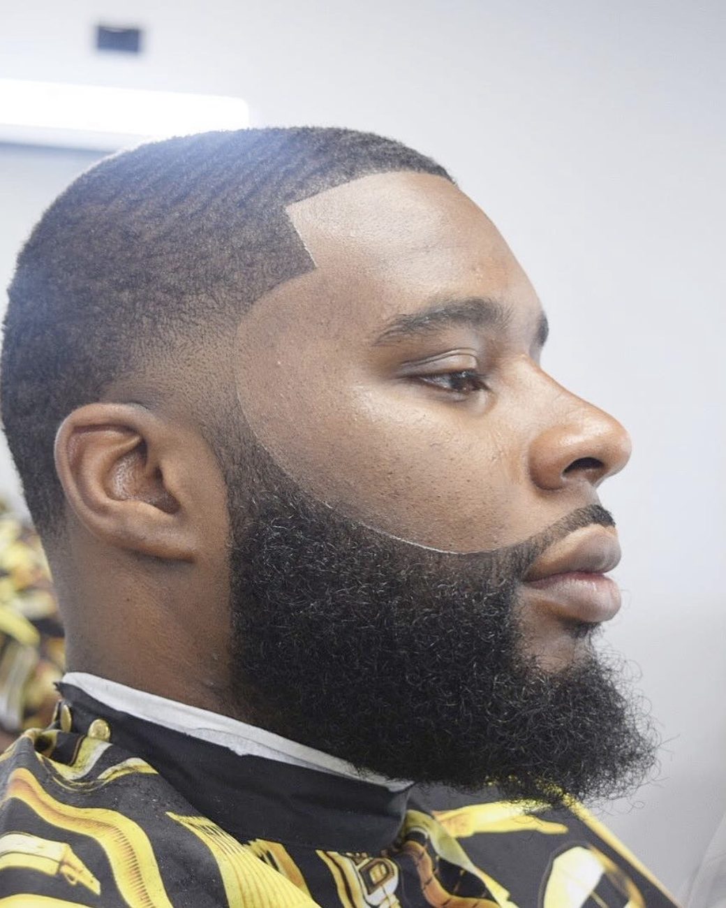 Sharp line-up with a full, sculpted beard