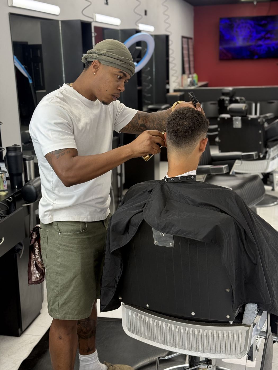 Brandon detailing a fade
